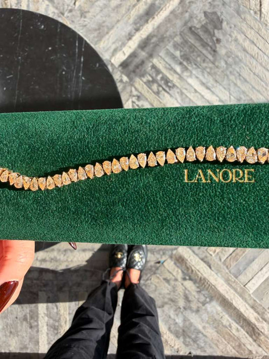 North/South Fancy Yellow Pear Cut LG Diamond Tennis Bracelet (12ctw)