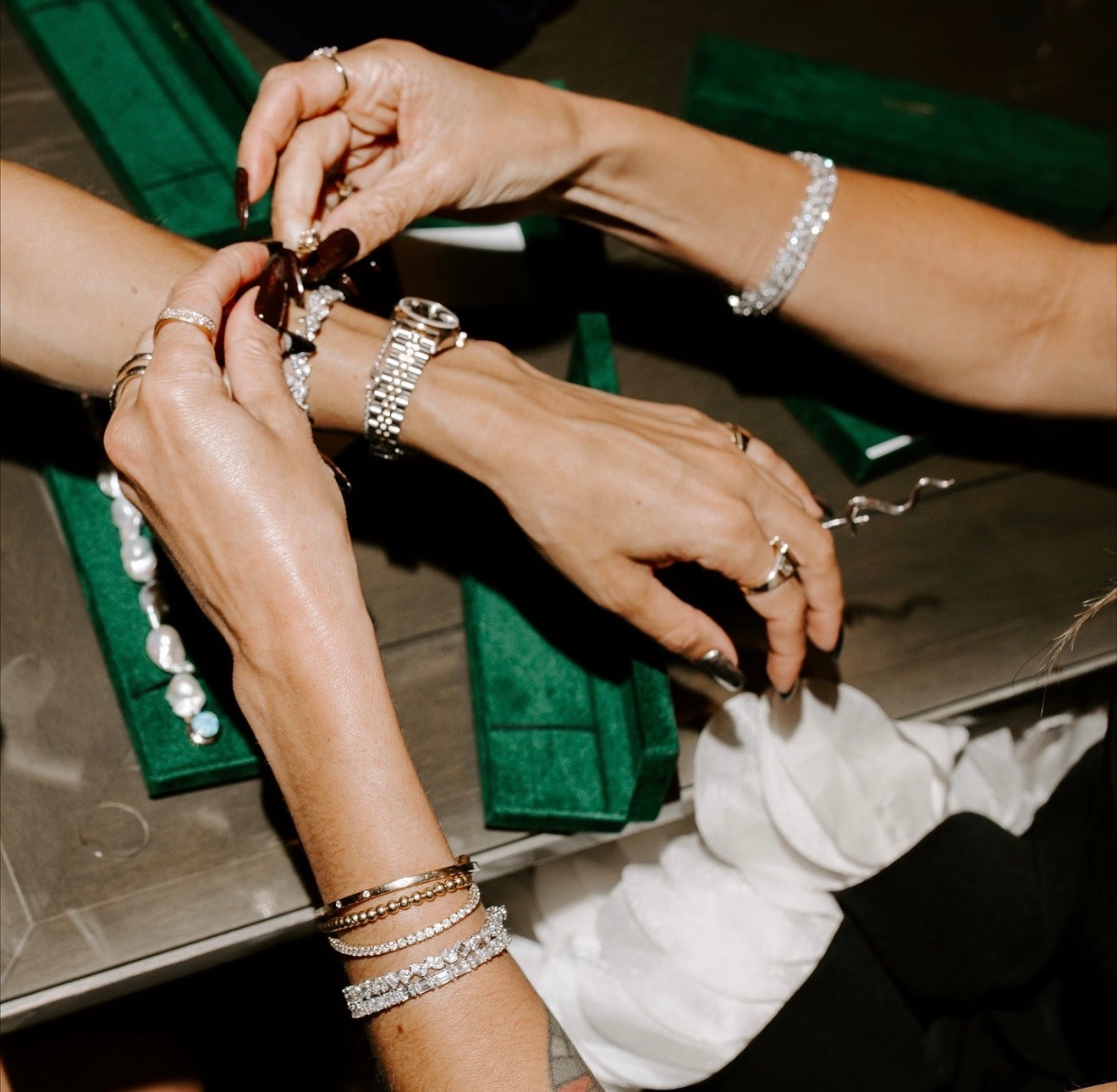 Diamond tennis bracelets being tried on at a Lanore pop up appointment